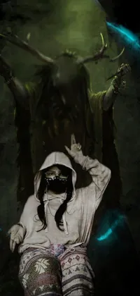 This mobile live wallpaper depicts a digital art of a woman sitting on a chair facing a menacing demon