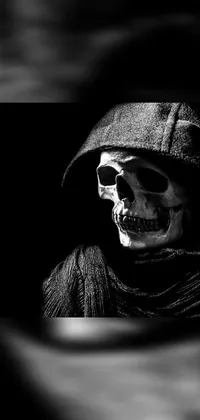 This gothic wallpaper is a black and white photo of a skeleton wearing a hoodie