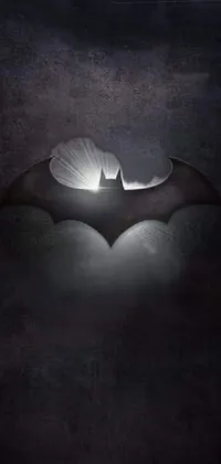 Looking for an awesome live wallpaper for your phone? Check out this amazing Batman-themed design! Featuring a close-up of the iconic Batman logo on a dark, mysterious background, this wallpaper is sure to impress