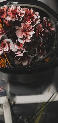 This dynamic live wallpaper for your phone showcases sci-fi inspired digital art featuring an astronaut wearing a bouquet of flowers while spacewalking