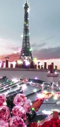 This phone live wallpaper captures a stunning view of the Eiffel Tower in Paris, featuring a unique perspective from the top of a building