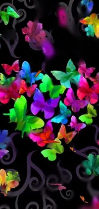 This phone live wallpaper depicts a vibrant display of multi-hued butterflies against a black background