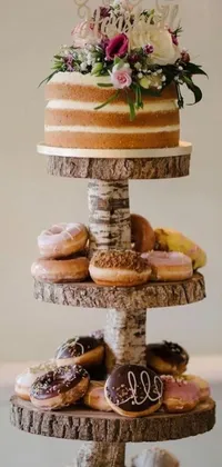 This live wallpaper depicts a three-layered cake with donuts as toppings