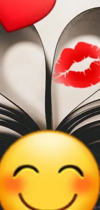 This phone live wallpaper depicts an open book with a heart-shaped kiss emerging from its pages