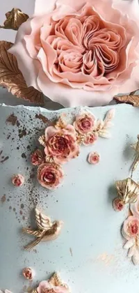 Decorate your phone's home screen with a stunning live wallpaper that features a pastel blue cake adorned with exquisite flower decorations