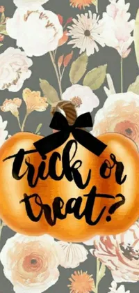 This lively Halloween-inspired live wallpaper showcases a cheerful pumpkin with the writing "trick or treat" set against a charming floral background