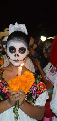 This live wallpaper features an energetic Day of the Dead scene with people dressed in festive costumes