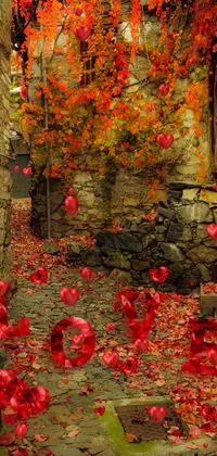 This live wallpaper depicts a charming autumn scene with a walkway covered in red and golden leaves