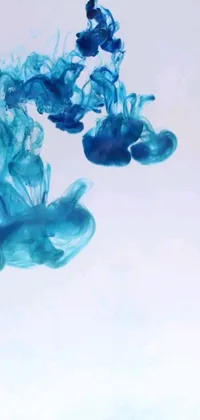 Feast your eyes on an enchanting phone live wallpaper depicting a vibrant blue substance swirling in water