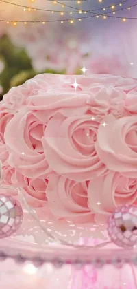 This live wallpaper features a delightful pink cake on a glass plate, surrounded by pink rose petals and sparkles