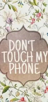 This live wallpaper showcases a vintage phone with the &quot;don&#39;t touch my phone&quot; warning emblazoned across it, set against a flowery backdrop