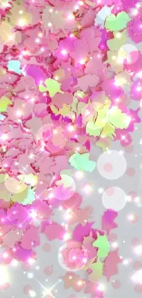 This phone live wallpaper features a vivid close-up of colorful confetti pieces arranged in a festive manner