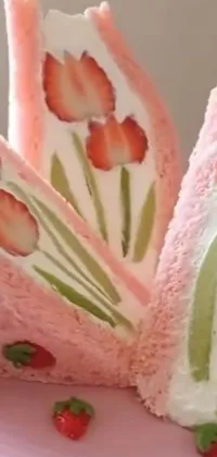 This phone live wallpaper features a colorful close-up of a cake on a plate, inspired by art nouveau design