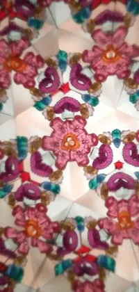 This phone live wallpaper features a digital art depiction of a paper plate with flowers that looks like a kaleidoscope