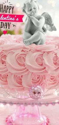 This mobile live wallpaper showcases a lovely pink cake adorned with an adorable angel atop its several layers of frosted sweetness