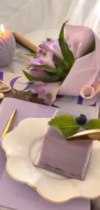 This mobile live wallpaper showcases a vibrant violet themed close-up of a delectable plate of wrapped food delicacies placed on a table