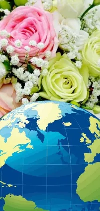 This stunning live wallpaper features a close-up view of a globe with delicate flowers in the background