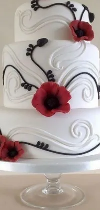 This stunning live wallpaper for your phone features a white wedding cake with red flowers sitting in the center of the screen