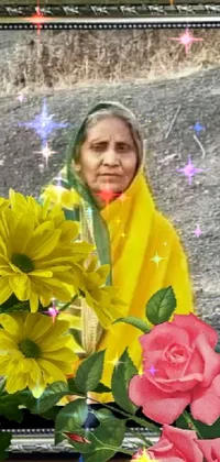 This phone live wallpaper features a stunning image of an elderly woman sitting peacefully atop a rock covered in colorful flowers