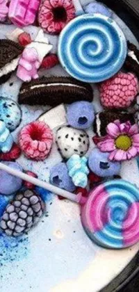 This mobile phone live wallpaper showcases a striking close-up image of a plate of food made entirely from sweets
