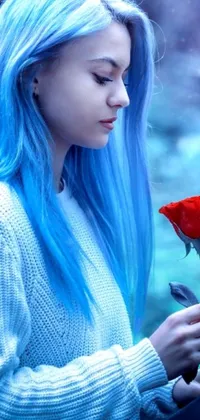 Enhance the look of your smartphone with this mesmerizing live wallpaper depicting a girl with striking blue hair holding a rose