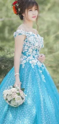 This stunning phone live wallpaper showcases a beautiful woman wearing a blue dress holding a bouquet of flowers