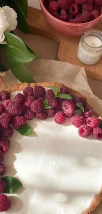 This live wallpaper features a close up of a mouthwatering pie with ripe raspberries on top