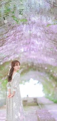 This phone live wallpaper showcases a stunning ulzzang-styled artwork of a woman standing beneath a lovely purple flower canopy