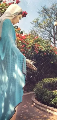 This phone live wallpaper displays a captivating statue of a woman in a blue robe