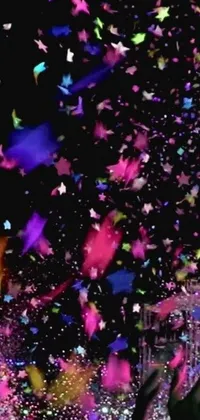 This live phone wallpaper showcases an exquisite digital artwork that captures a person in the act of throwing multicolored confetti up in the air