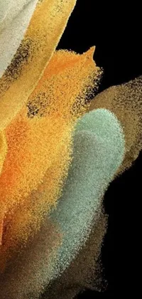 This live wallpaper features a close up of colored powder on a black background, creating a beautiful and ever-changing visual display