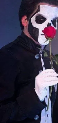 Revamp your phone's wallpaper with a twisted live image of a clown holding a rose