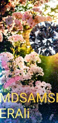 This stunning live wallpaper features a brilliantly crafted diamond sitting atop a lush green field, surrounded by beautiful blooming sakura trees