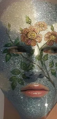 This live phone wallpaper features a stunning close-up shot of a person's face with glittery makeup and a floral facemask
