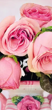 Get enchanted with this phone live wallpaper - a vase full of pink roses delicately placed on a table