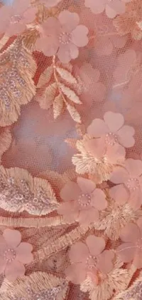 This stunning live wallpaper features intricately embroidered foliage on a peach-colored dress