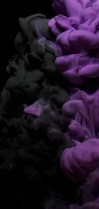 Experience an ethereal live wallpaper with a dramatic and captivating purple and black substance design
