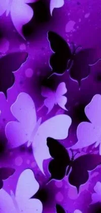 Add some visual interest to your phone background with this digital art live wallpaper featuring a sea of purple and black butterflies fluttering about on a luscious, lavender backdrop