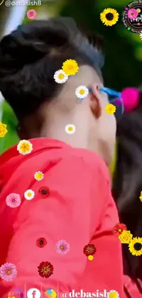 This lively phone live wallpaper captures a detailed close-up shot of a teenage boy wearing flowers in his hair