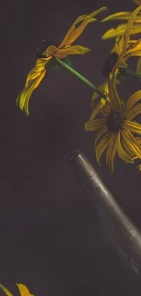 This phone live wallpaper features a stunning still life of a vase filled with yellow flowers