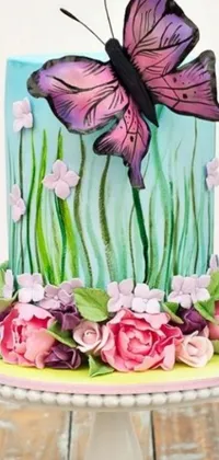 This phone live wallpaper features a close up of a intricately designed cake adorned with delicate flowers and swirling icing