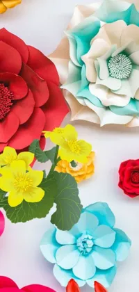 This live wallpaper showcases a stunning arrangement of paper flowers on a wooden table