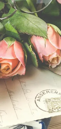 This phone live wallpaper showcases a stunning bouquet of pink roses beautifully arranged on top of an old vintage book