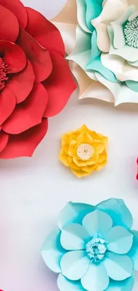This live wallpaper features a stunning display of paper flowers in various sizes and colors