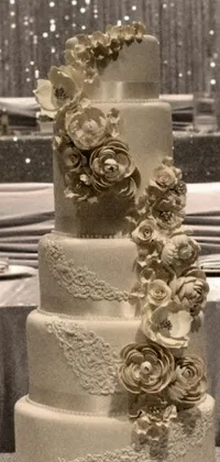 This exquisite live phone wallpaper features a beautifully decorated wedding cake sitting on a table