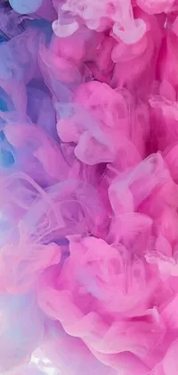 This stunning live wallpaper showcases a captivating close-up view of flowing pink and blue smoke, resembling delicate brushstrokes on a canvas