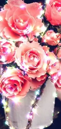 This phone live wallpaper features a vase filled with pink roses sitting on a wooden table, enhanced with glittering light