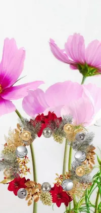 Get lost in the beauty of this phone live wallpaper featuring hyperrealistic miniature cosmos flowers in a vase and silver ornaments
