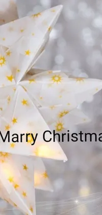 This live wallpaper for your phone captures the essence of the holiday season with a stunning close-up image of a Christmas star decoration