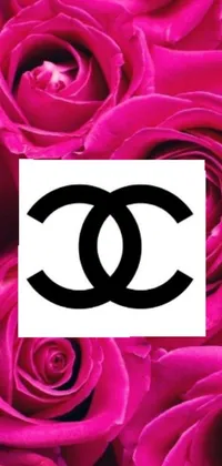 This mobile wallpaper showcases a stunning Chanel logo amidst beautiful pink roses, highlighting an alluring and chic design perfect for fashion-forward women